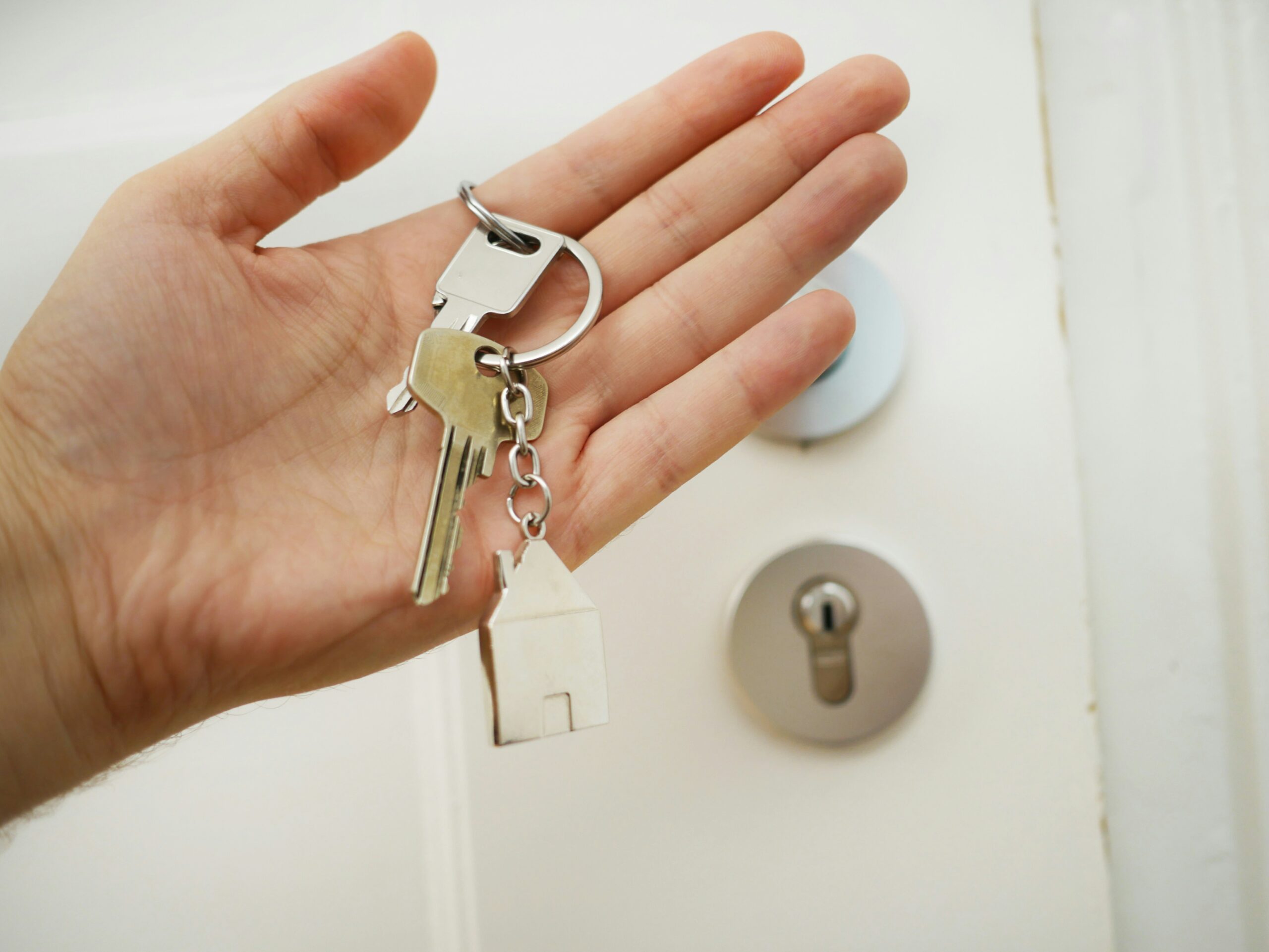 handing over the keys a hand holding a key chain